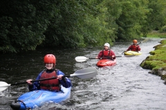 3 river kayakers